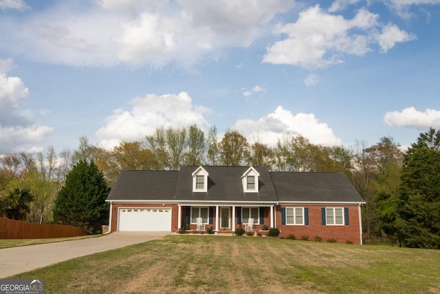 cape cod home featuring fence, concrete driveway, a front yard, brick siding, and a porch