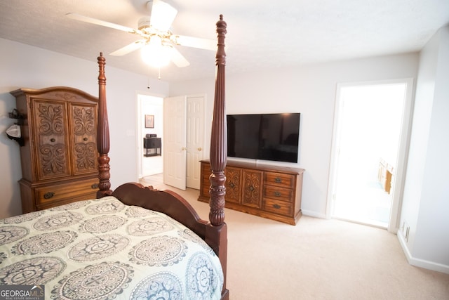 bedroom with a ceiling fan, baseboards, and light colored carpet