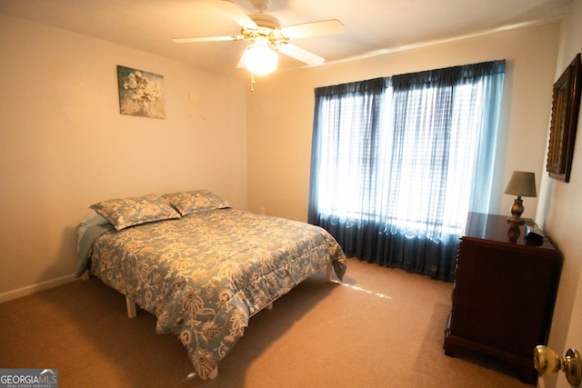 bedroom featuring baseboards, carpet flooring, and ceiling fan