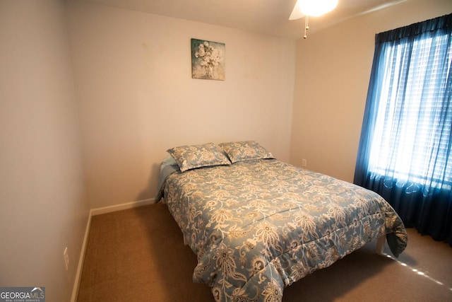 bedroom featuring carpet flooring and baseboards