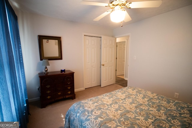 bedroom featuring baseboards, a closet, carpet flooring, and a ceiling fan