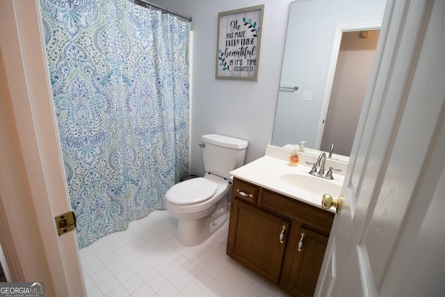 bathroom featuring toilet, vanity, a shower with shower curtain, and tile patterned flooring