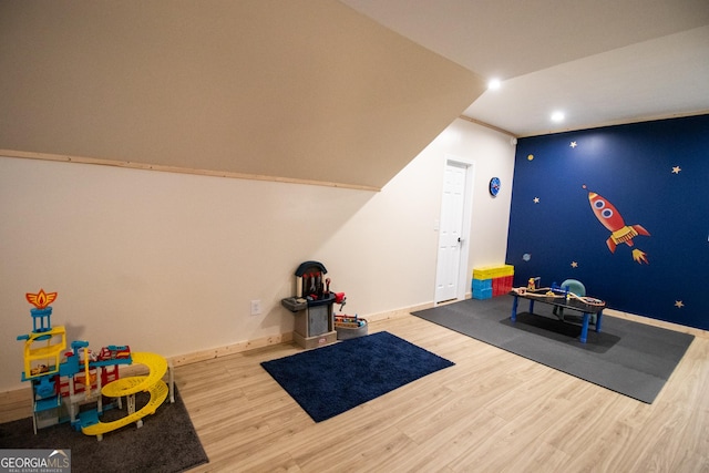 rec room with baseboards, wood finished floors, and recessed lighting