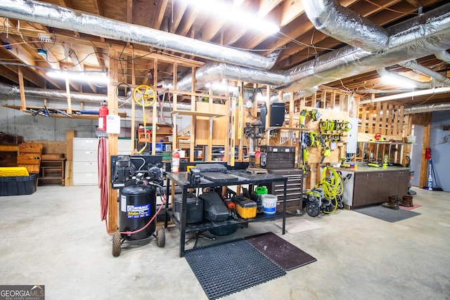 unfinished basement with a workshop area
