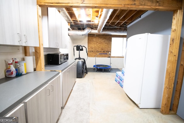 basement with freestanding refrigerator