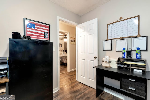 181 King St, Clermont, GA 30527 - interior space with dark wood-type flooring, a textured ceiling, baseboards, an office area, and dark countertops