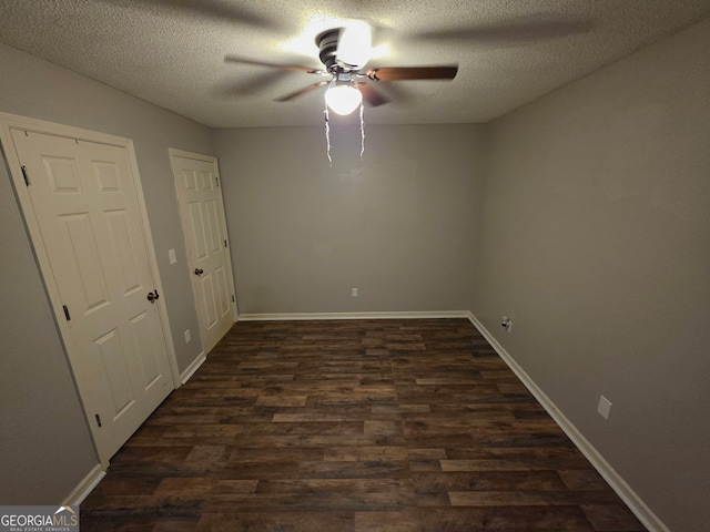 181 King St, Clermont, GA 30527 - empty room featuring ceiling fan, dark wood finished floors, a textured ceiling, and baseboards