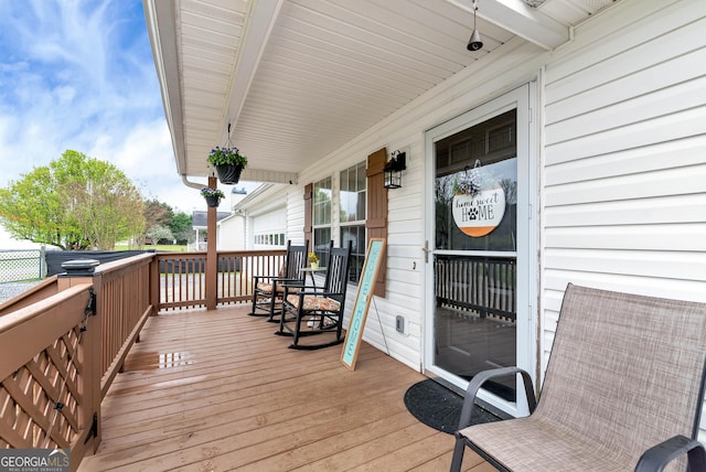181 King St, Clermont, GA 30527 - wooden deck featuring covered porch