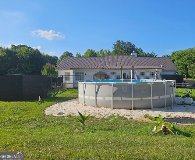 181 King St, Clermont, GA 30527 - back of property with metal roof and a chimney