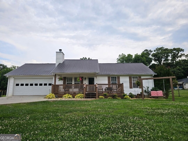 181 King St, Clermont, GA 30527 - single story home featuring an attached garage, metal roof, concrete driveway, a front lawn, and a chimney