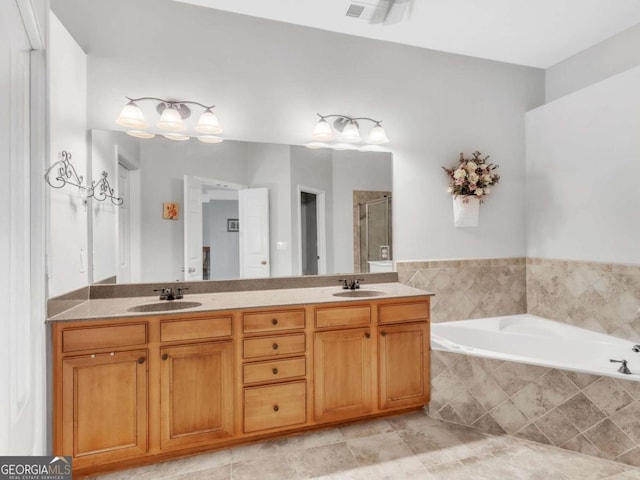 5454 Alanis Pl SE Unit 19, Mableton, GA 30126 - bathroom featuring a garden tub, double vanity, and a stall shower