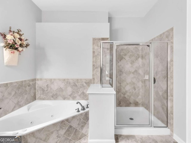 5454 Alanis Pl SE Unit 19, Mableton, GA 30126 - bathroom featuring a jetted tub and a shower stall