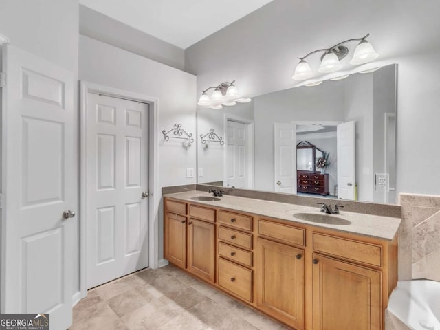 5454 Alanis Pl SE Unit 19, Mableton, GA 30126 - bathroom with double vanity, a tub, and tile patterned floors