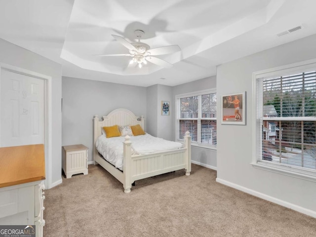 5454 Alanis Pl SE Unit 19, Mableton, GA 30126 - carpeted bedroom featuring a raised ceiling and a ceiling fan