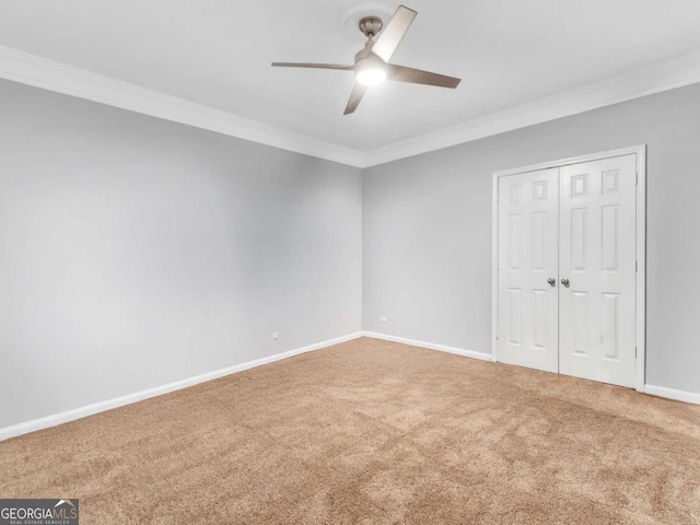 5454 Alanis Pl SE Unit 19, Mableton, GA 30126 - unfurnished bedroom featuring ornamental molding, carpet flooring, a closet, and ceiling fan