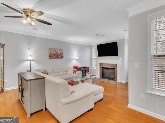 5454 Alanis Pl SE Unit 19, Mableton, GA 30126 - living room with a ceiling fan, ornamental molding, a high end fireplace, and light wood-style flooring