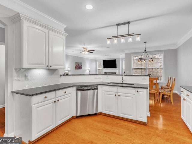 5454 Alanis Pl SE Unit 19, Mableton, GA 30126 - kitchen featuring dishwasher, crown molding, a peninsula, light wood-style flooring, and white cabinetry