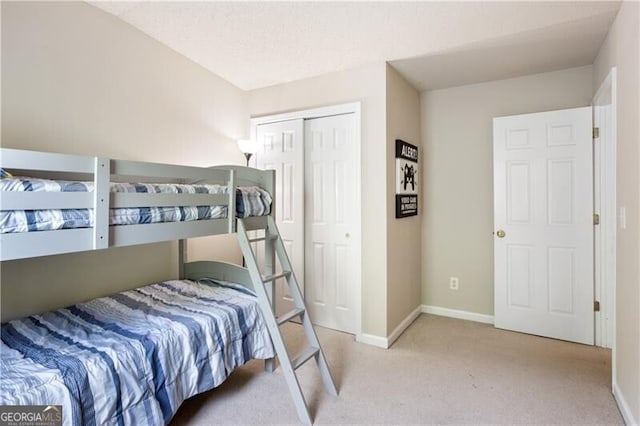 223 Riverstone Commons Cir, Canton, GA 30114 - carpeted bedroom featuring a closet and baseboards