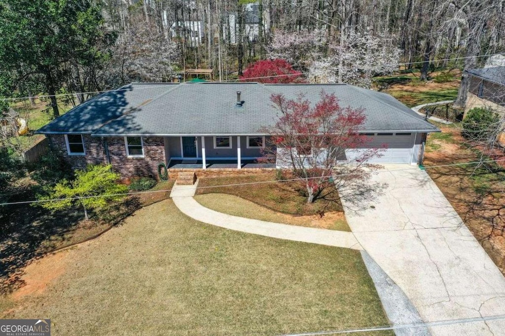 1564 Pedro Dr SW, Mableton, GA 30126 - single story home featuring concrete driveway, an attached garage, and a front lawn