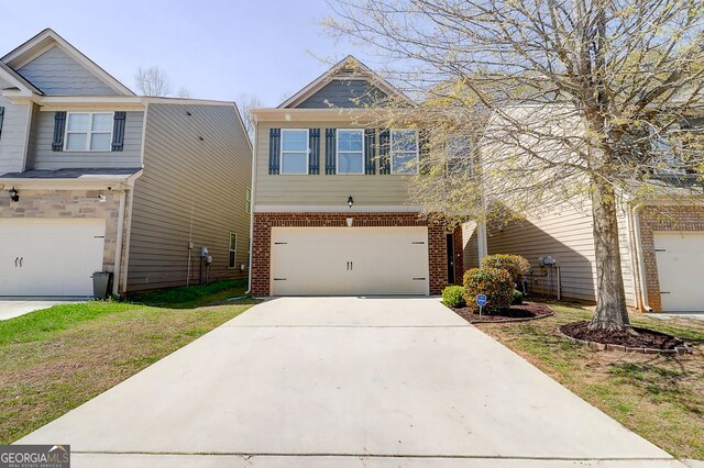 2205 Capella Cir SW, South Fulton, GA 30331 - view of front of property featuring driveway, brick siding, and a garage