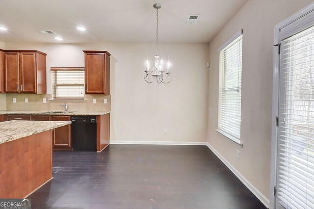 2205 Capella Cir SW, South Fulton, GA 30331 - kitchen with visible vents, baseboards, black dishwasher, tasteful backsplash, and an inviting chandelier