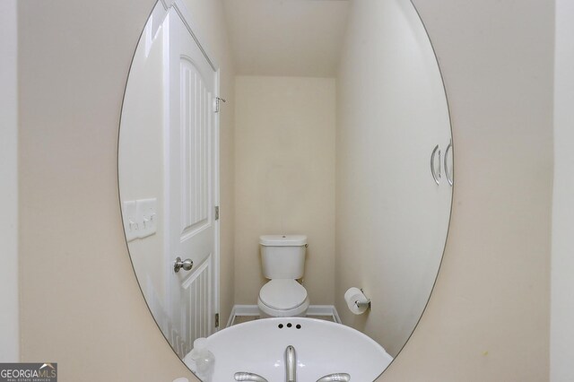 2205 Capella Cir SW, South Fulton, GA 30331 - bathroom with baseboards and toilet