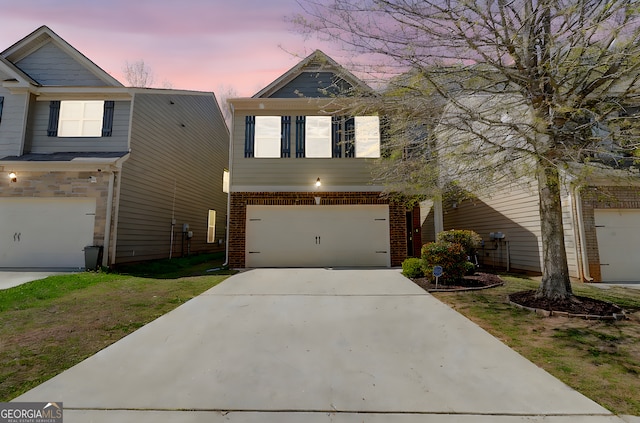 2205 Capella Cir SW, South Fulton, GA 30331 - view of front of property with driveway, a garage, and brick siding
