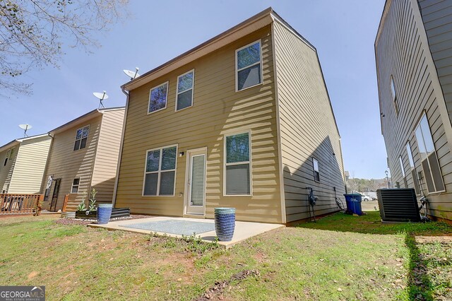 2205 Capella Cir SW, South Fulton, GA 30331 - rear view of property with cooling unit, a yard, and a patio area