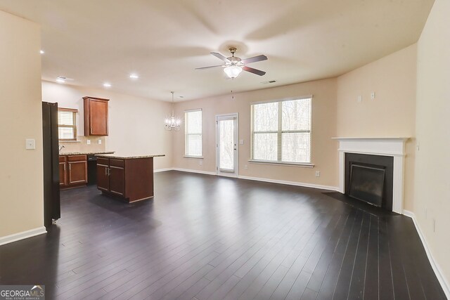 2205 Capella Cir SW, South Fulton, GA 30331 - unfurnished living room with a fireplace with flush hearth, dark wood-style floors, baseboards, ceiling fan with notable chandelier, and visible vents