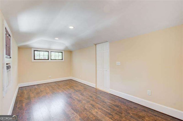 unfurnished room with baseboards, recessed lighting, and wood-type flooring