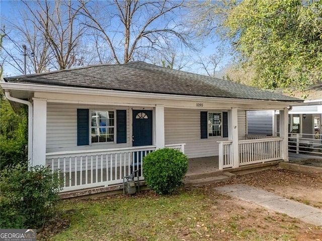 1090 Harwell St NW, Atlanta, GA 30314 - view of front of property with a shingled roof and covered porch