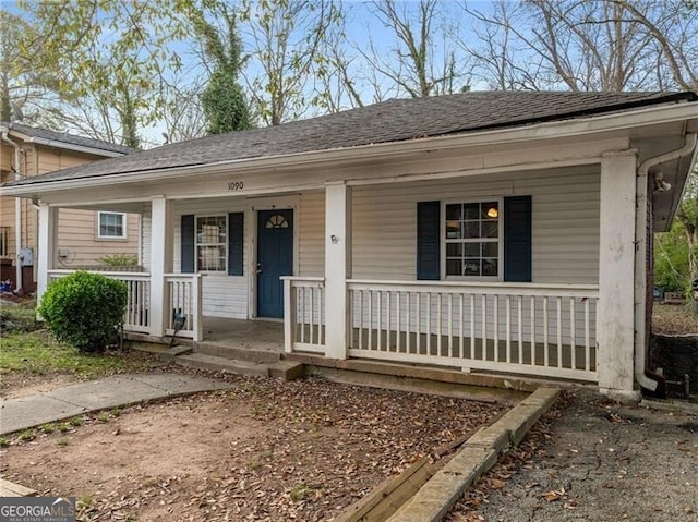 1090 Harwell St NW, Atlanta, GA 30314 - view of front facade with a shingled roof and a porch