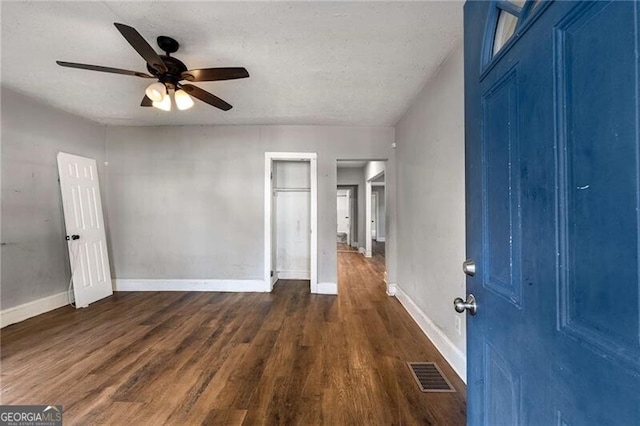 1090 Harwell St NW, Atlanta, GA 30314 - entryway featuring dark wood-style flooring, baseboards, a textured ceiling, visible vents, and a ceiling fan