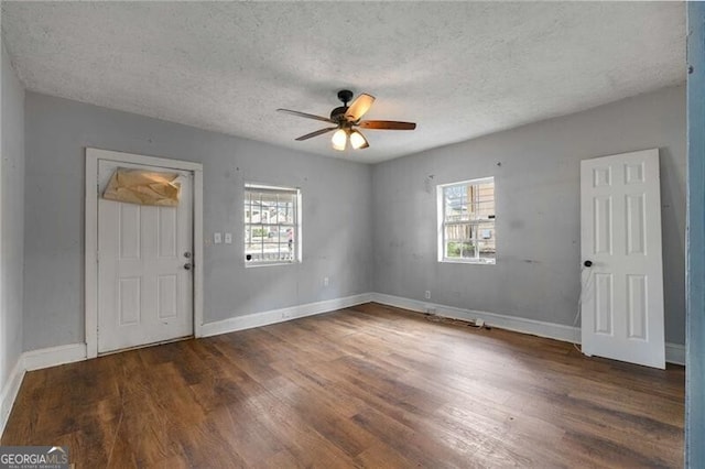 1090 Harwell St NW, Atlanta, GA 30314 - entryway with a textured ceiling, wood finished floors, ceiling fan, and a healthy amount of sunlight