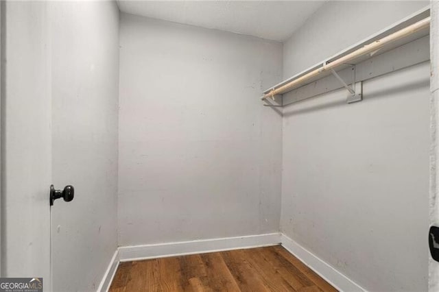 1090 Harwell St NW, Atlanta, GA 30314 - walk in closet featuring wood finished floors