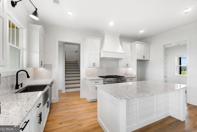 284 Community House Rd, Barnesville, GA 30204 - kitchen with premium range hood, decorative backsplash, white cabinets, and recessed lighting