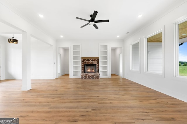 284 Community House Rd, Barnesville, GA 30204 - unfurnished living room featuring ornamental molding, built in shelves, ceiling fan, light wood finished floors, and recessed lighting
