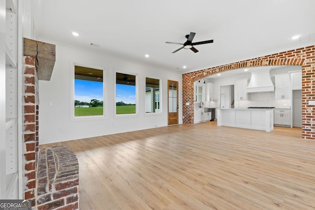 284 Community House Rd, Barnesville, GA 30204 - unfurnished living room with a ceiling fan, light wood-style flooring, ornamental molding, and recessed lighting