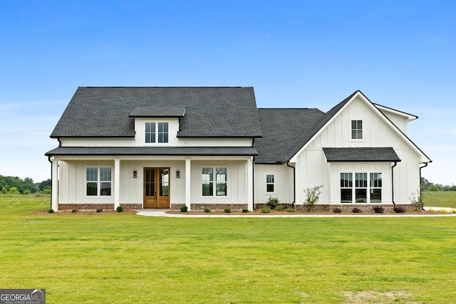 284 Community House Rd, Barnesville, GA 30204 - modern farmhouse style home featuring board and batten siding, a shingled roof, a front lawn, and french doors