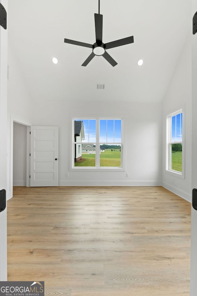 284 Community House Rd, Barnesville, GA 30204 - unfurnished living room with high vaulted ceiling, a ceiling fan, light wood-style floors, and recessed lighting