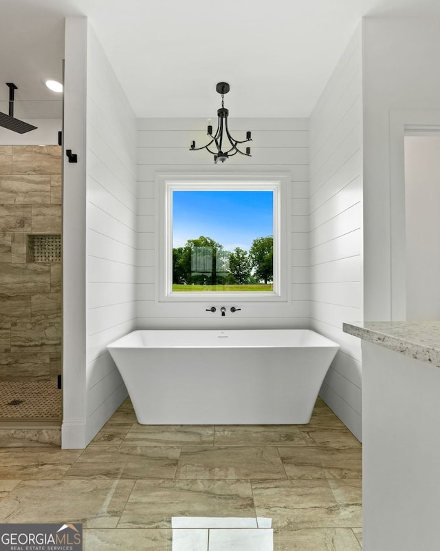 284 Community House Rd, Barnesville, GA 30204 - bathroom featuring a shower stall, a soaking tub, and a chandelier
