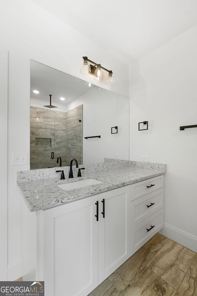 284 Community House Rd, Barnesville, GA 30204 - bathroom featuring a stall shower, vanity, recessed lighting, and marble look tile flooring