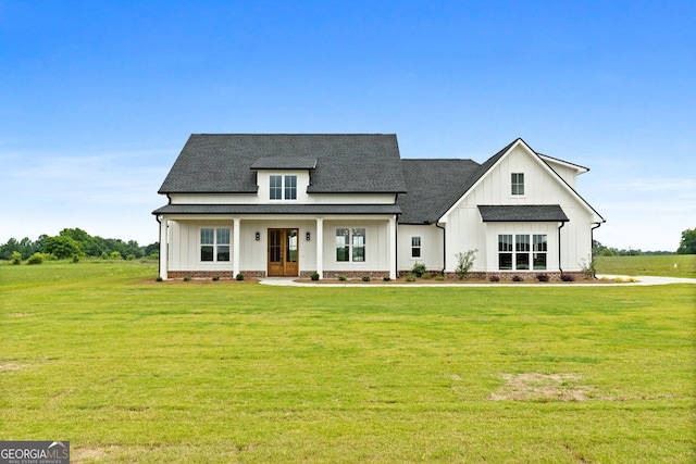 284 Community House Rd, Barnesville, GA 30204 - modern inspired farmhouse with board and batten siding, a front yard, roof with shingles, and french doors
