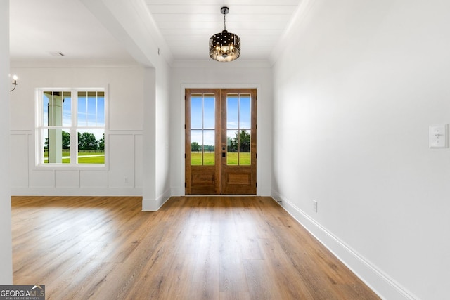 284 Community House Rd, Barnesville, GA 30204 - entryway featuring a chandelier, french doors, crown molding, and light wood-type flooring