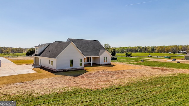 view of home's exterior with a garage, a yard, and concrete driveway