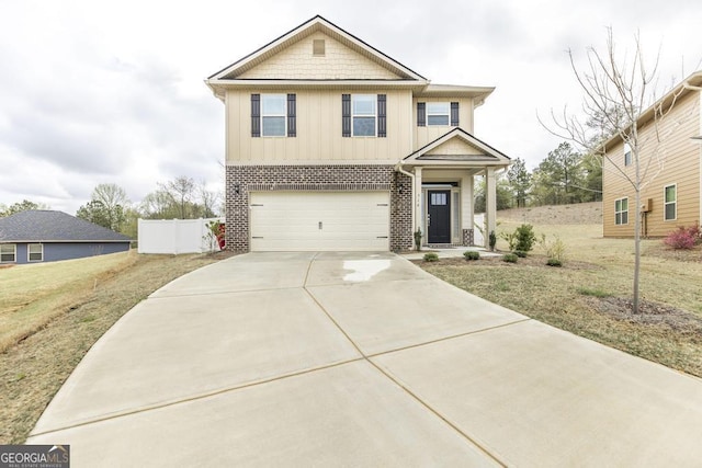 view of front facade featuring board and batten siding, fence, a front lawn, an attached garage, and concrete driveway
