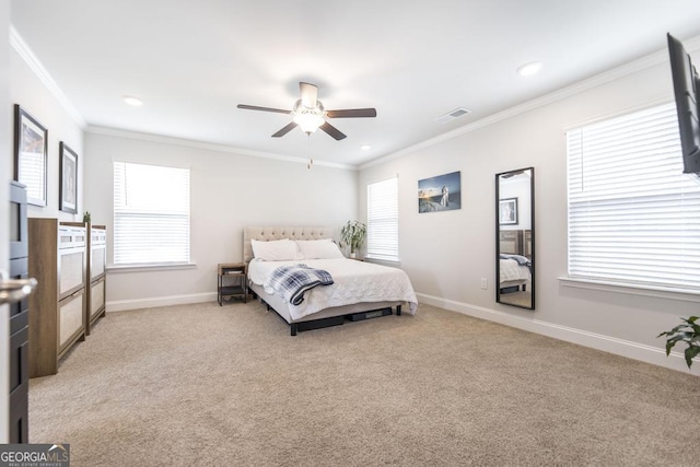bedroom with light carpet, visible vents, baseboards, and ornamental molding