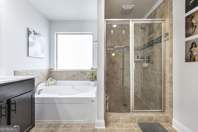 full bath with a shower stall, a garden tub, vanity, and visible vents