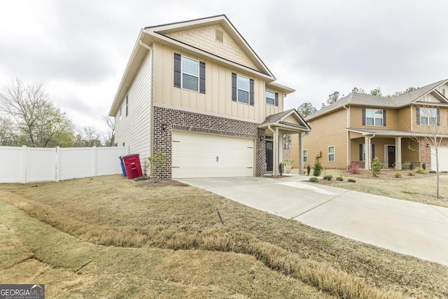 craftsman house with concrete driveway, board and batten siding, fence, and an attached garage