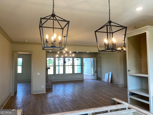 interior space featuring recessed lighting, baseboards, an inviting chandelier, and dark wood-style floors